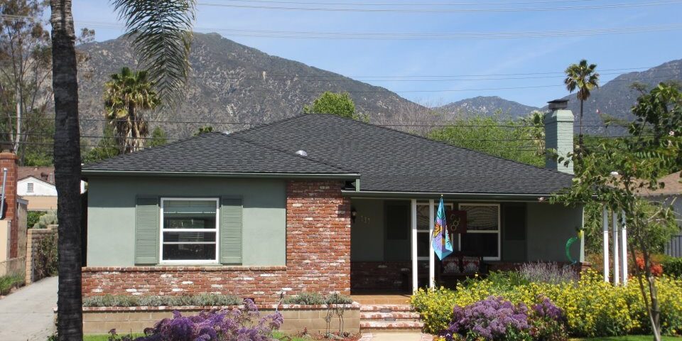 Roof in foreground with mountains in background