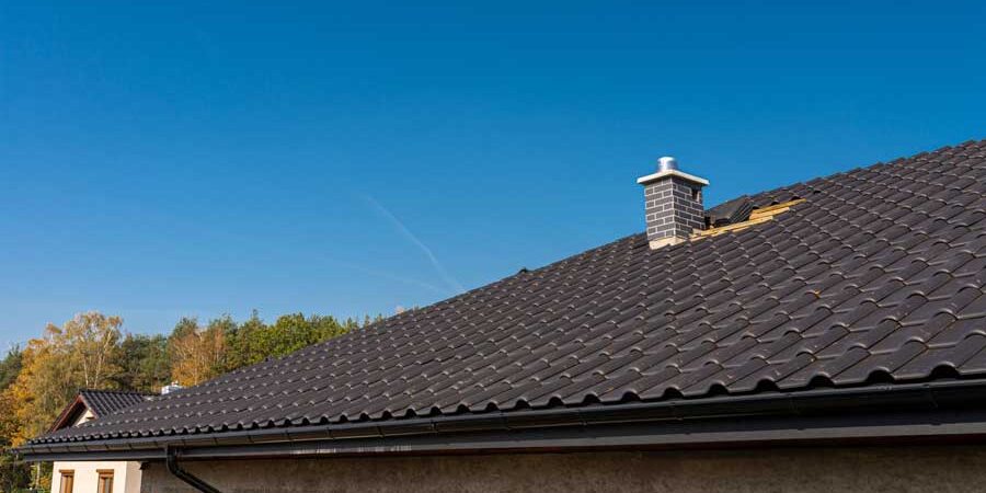 Roofing Contractor installing ceramic tile roof