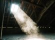 Light shining through a skylight into an attic.