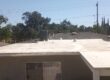 Home with white flat roof