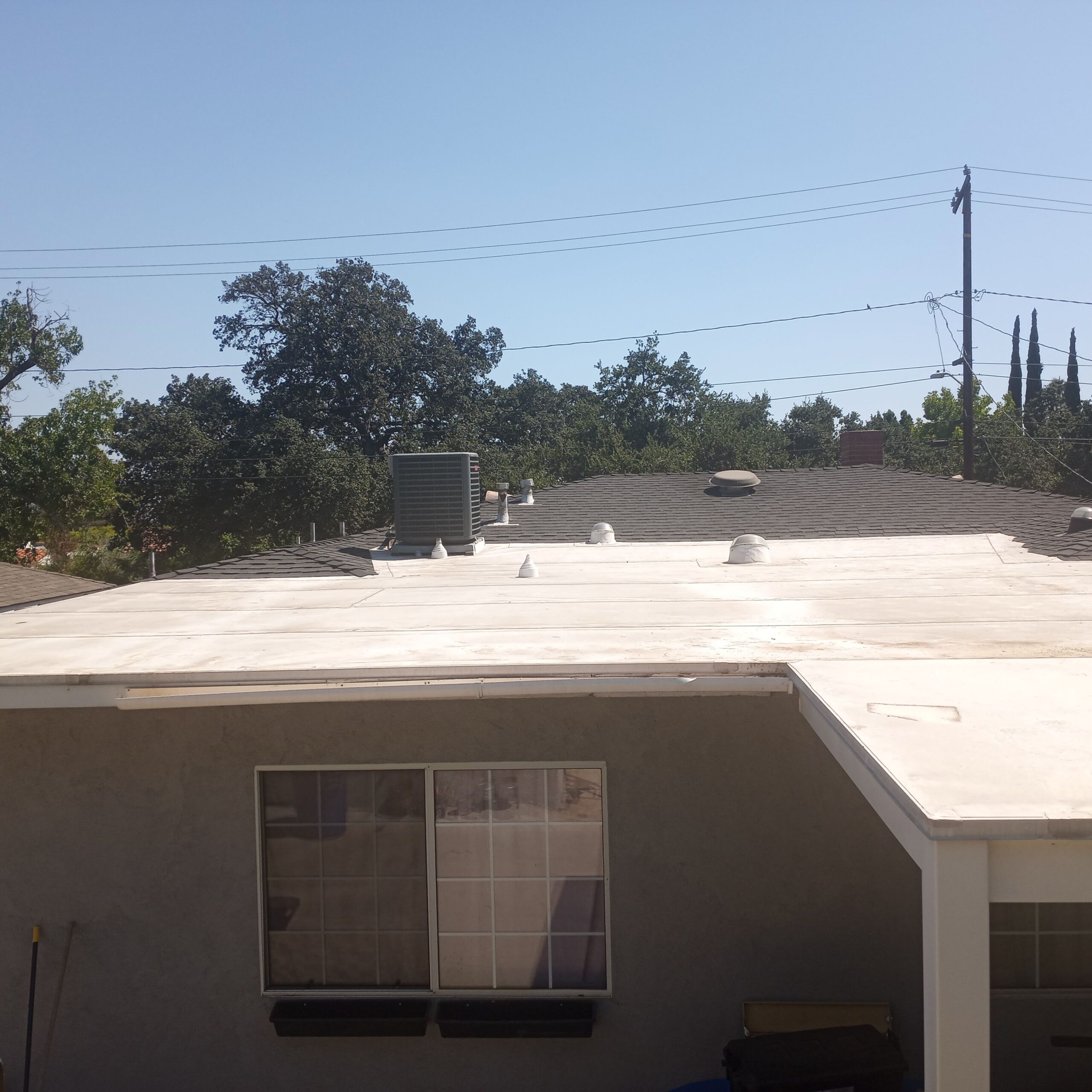 Home with white flat roof