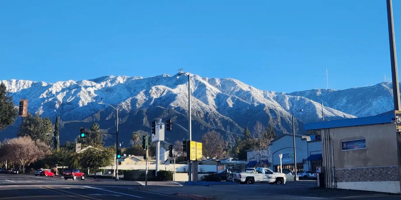 View of snow-covered mountains below Mt. Wilson, above Pasadena