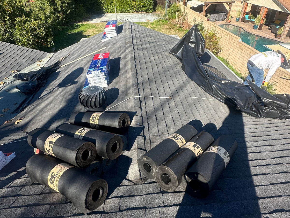 Workers installing a roofing.