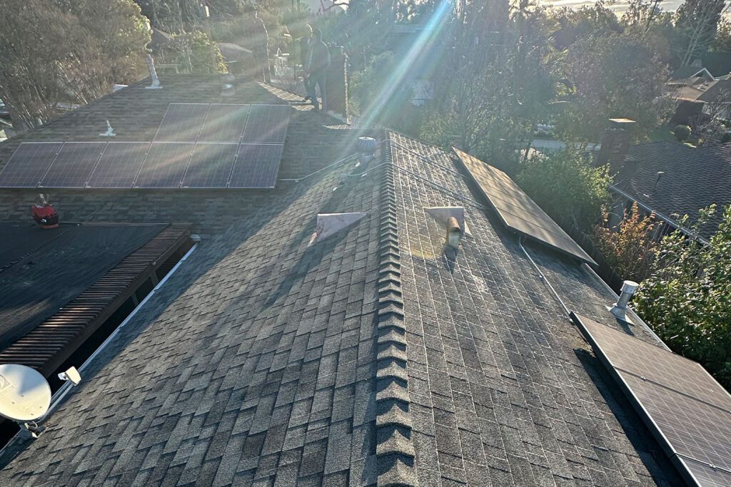 Finished roof with sun rays shining through the clouds.