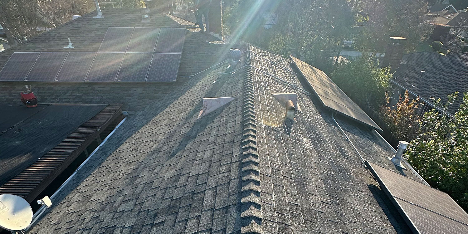 Finished roof with sun rays shining through the clouds.