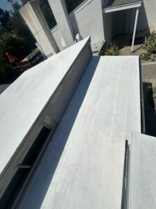 Residential roof painted white.