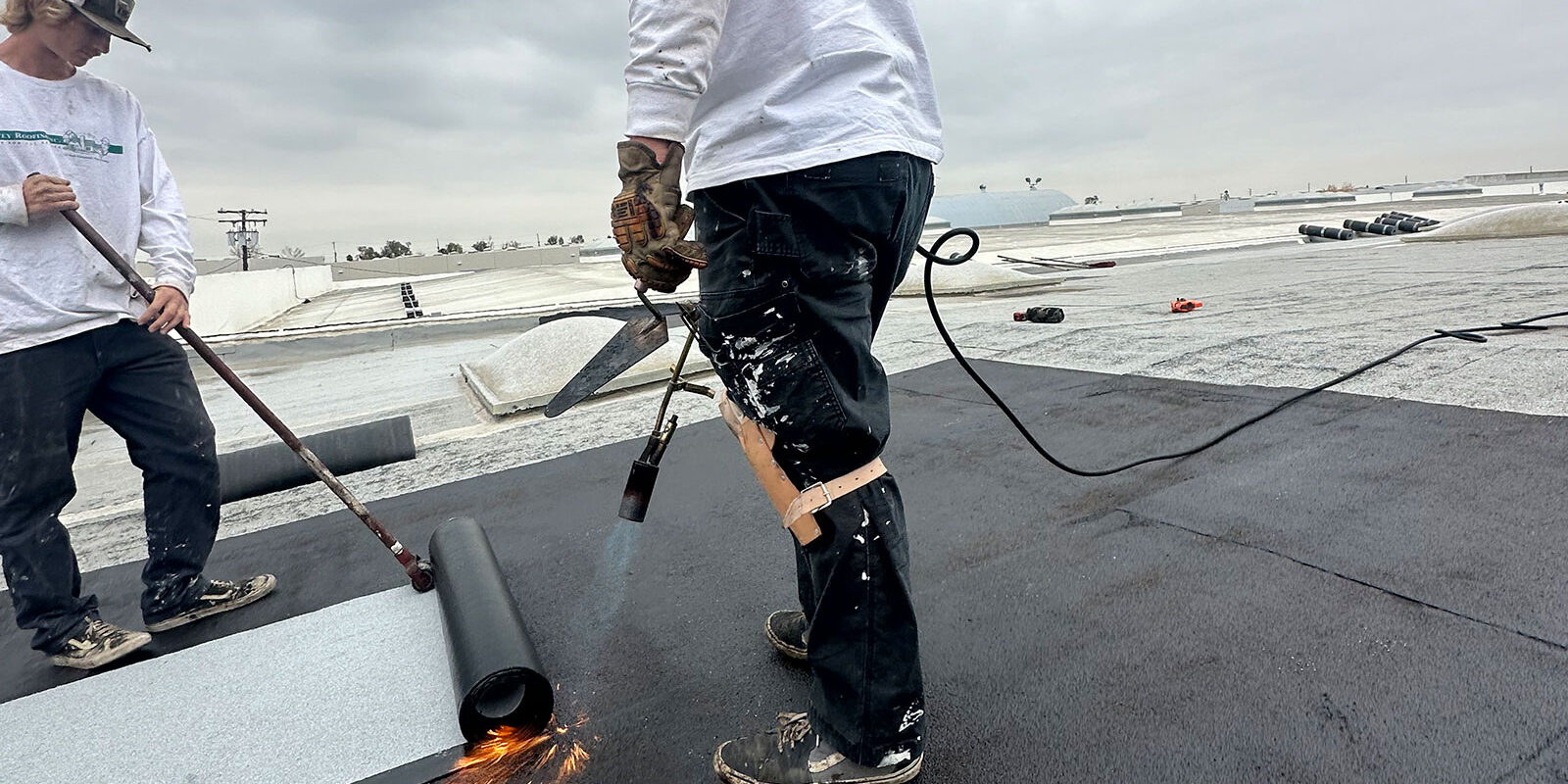 Workers-2 Workers installing a commercial roof.