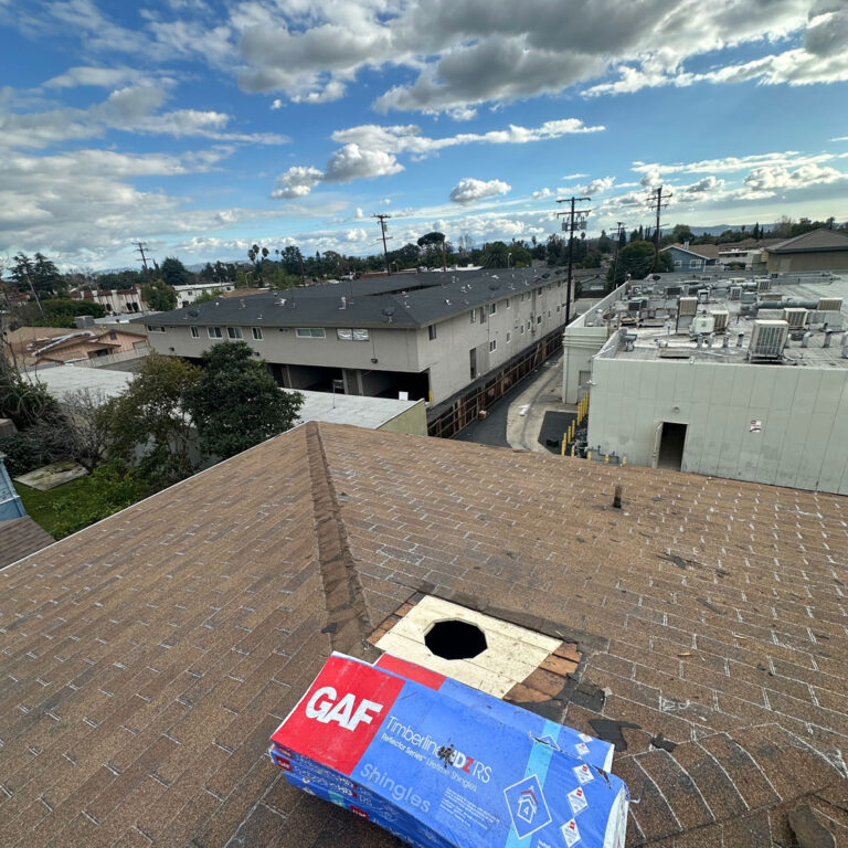 Apartment roof install showing the materials on roof.