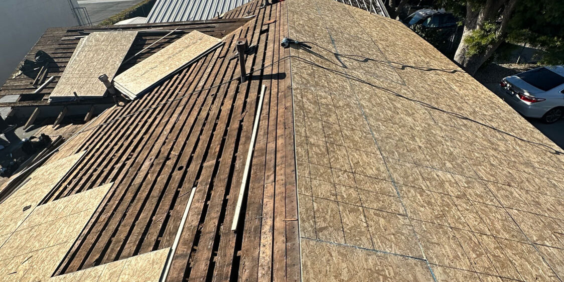 Roof install showing the roof before the roofing materials are applied.