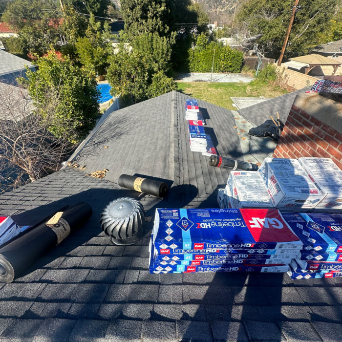 Beginnings of a residential roof install with the roofing materials shown.
