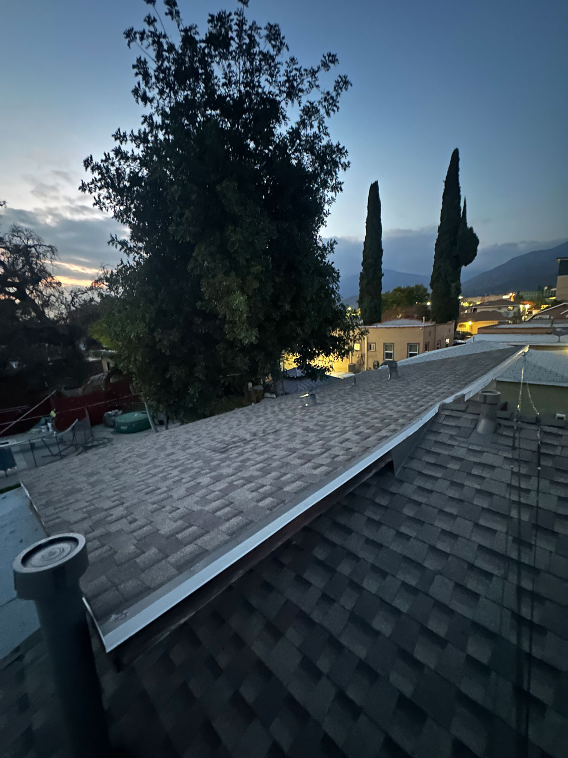 Finished residential roof install at night fall.