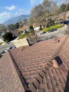 Finished residential roof install with chimney repair.