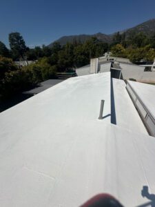 Residential roof painted white.