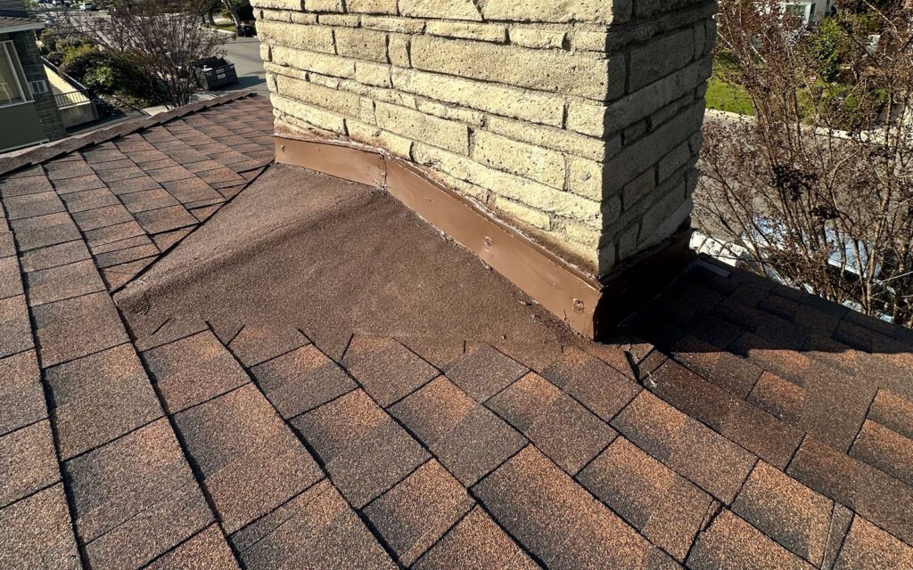Chimney on freshly roof installation.