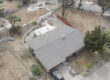 Ariel view of a house that survive the Eaton fires using roof fire protection from Garvey Roofing.
