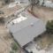 Ariel view of a house that survive the Eaton fires using roof fire protection from Garvey Roofing.