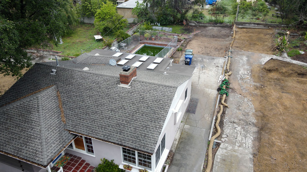 Aerial picture of a house roof that survive the Eaton fires.