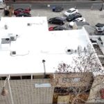 Torch coating being added to a roof.