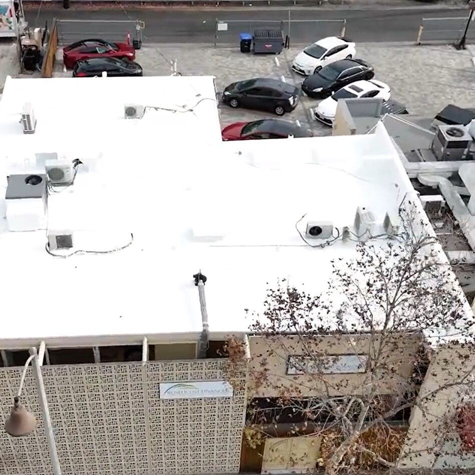 Torch coating being added to a roof.