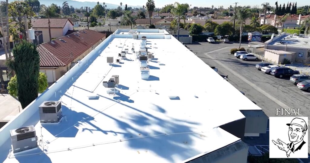 Torch coating being added to a commercial roof.