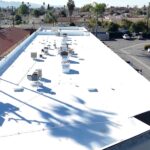 Torch coating being added to a commercial roof.