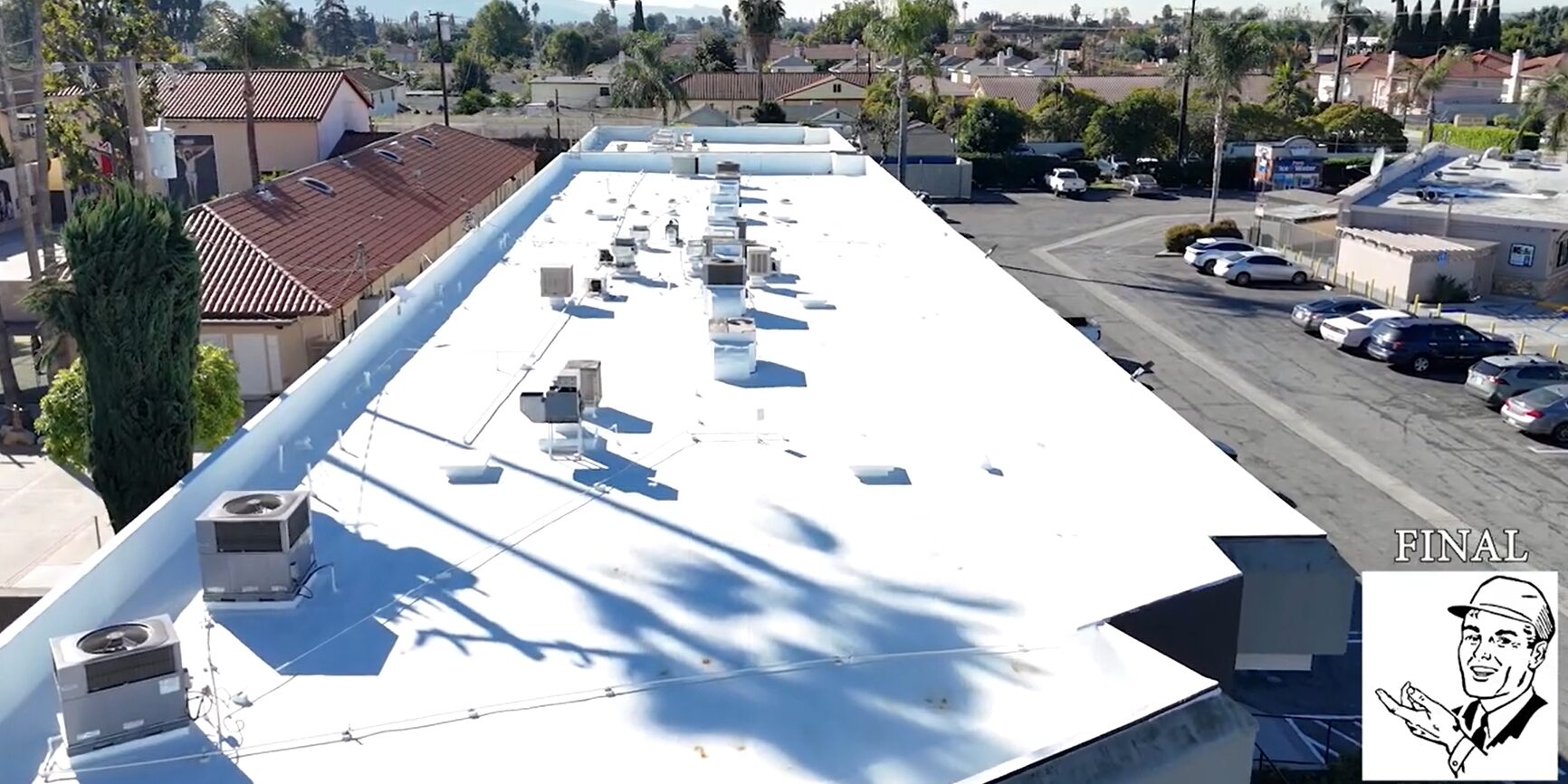 Torch coating being added to a commercial roof.