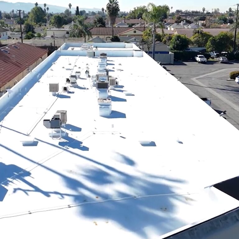 Torch coating being added to a commercial roof.