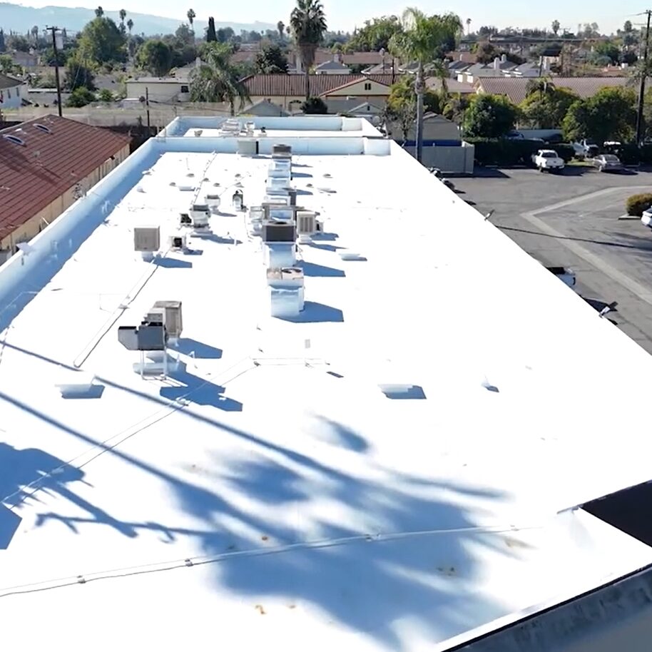 Torch coating being added to a commercial roof.