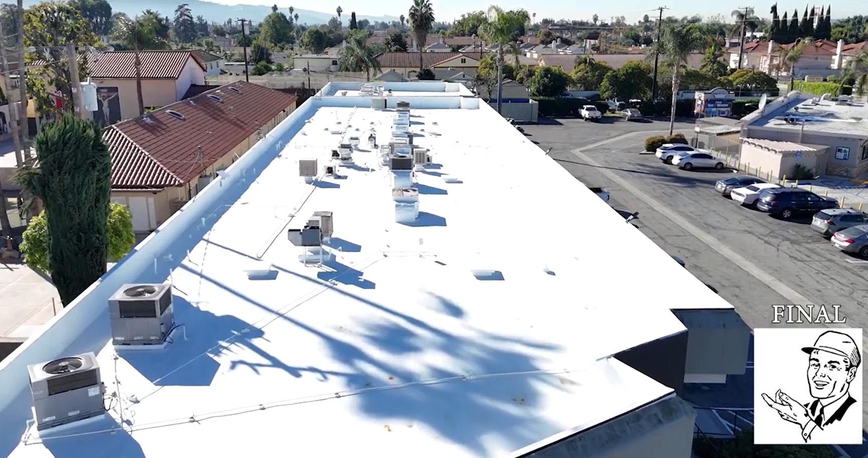 Torch coating being added to a commercial roof.