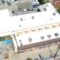 White silicone roof being installed on a commercial building.