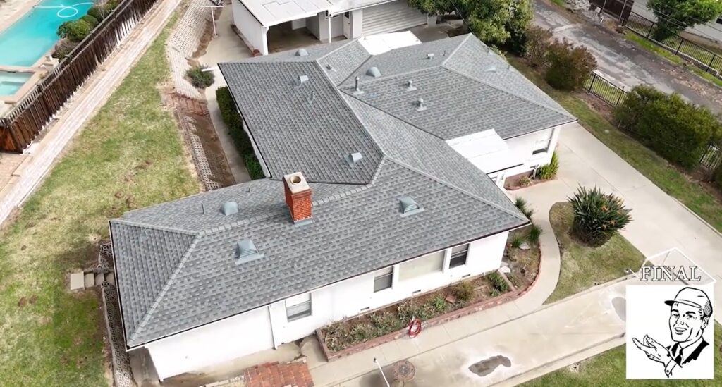 Shingle roof being installed on a residential house by Garvey Roofing Inc.