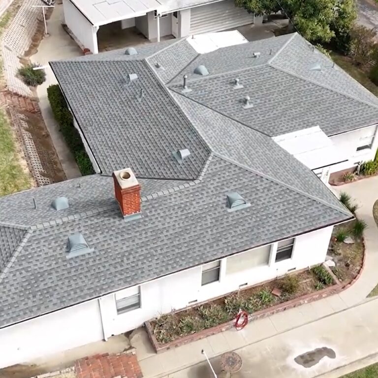 Shingle roof being installed on a residential house by Garvey Roofing Inc.