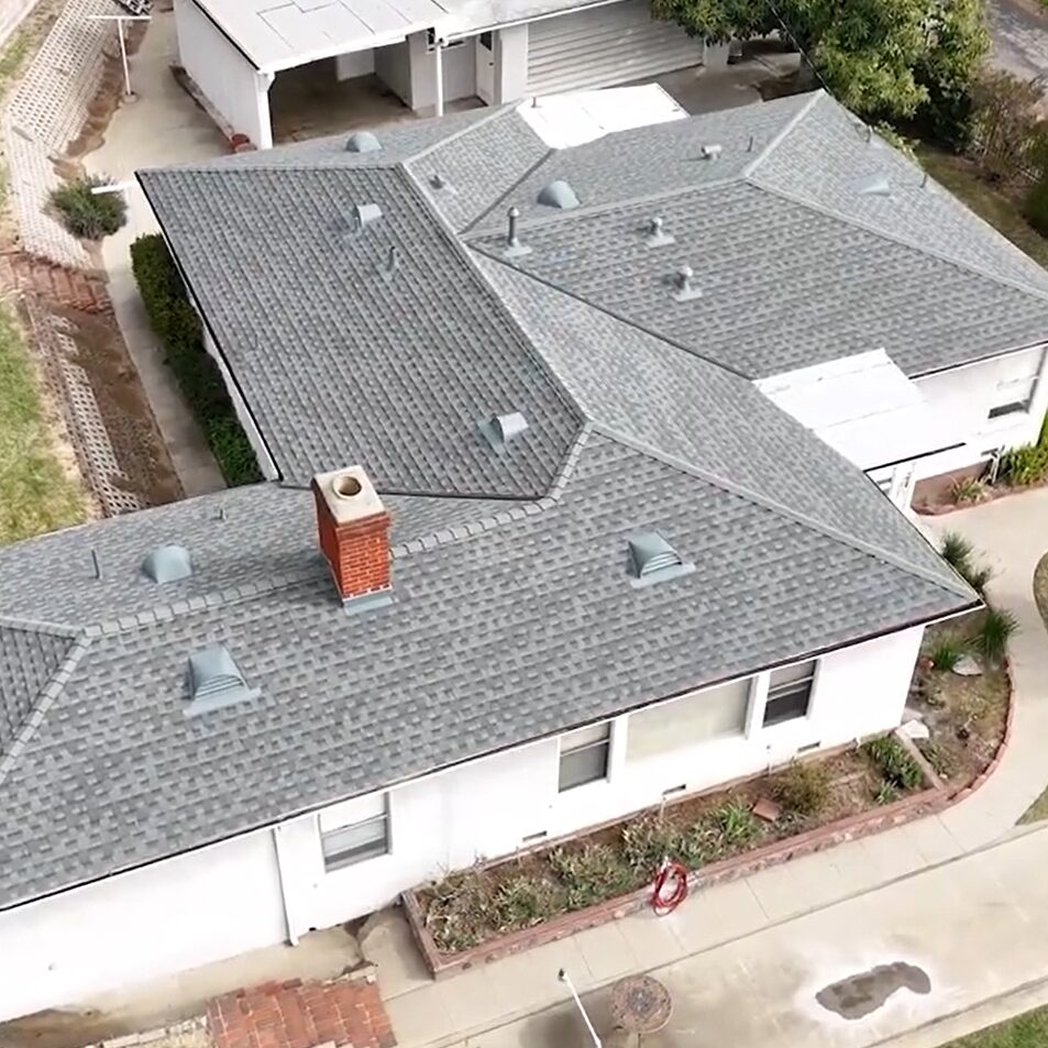 Shingle roof being installed on a residential house by Garvey Roofing Inc.