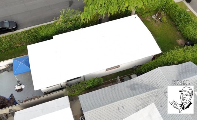 Torch coating being added to a roof.