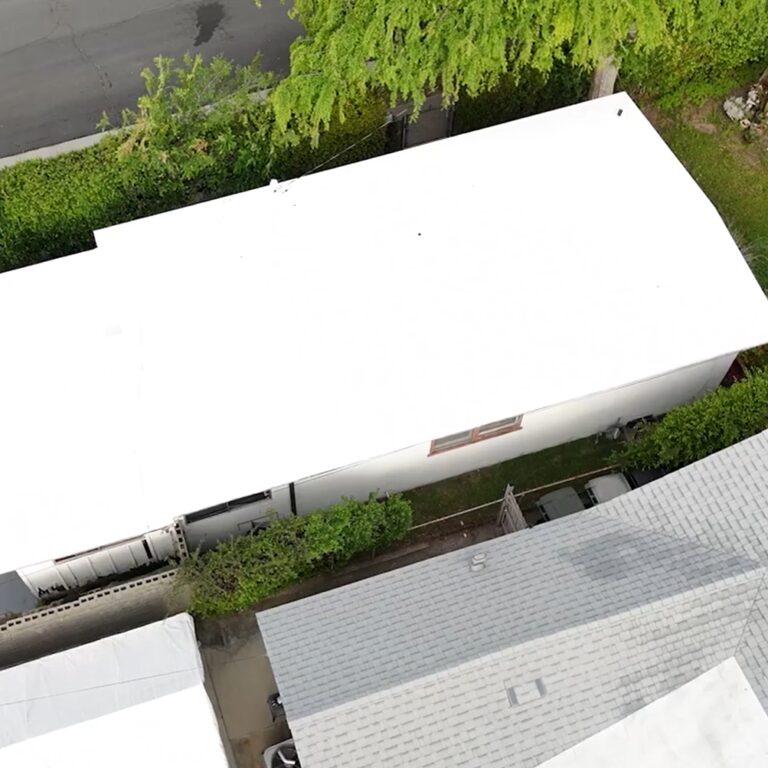 Torch coating being added to a roof.